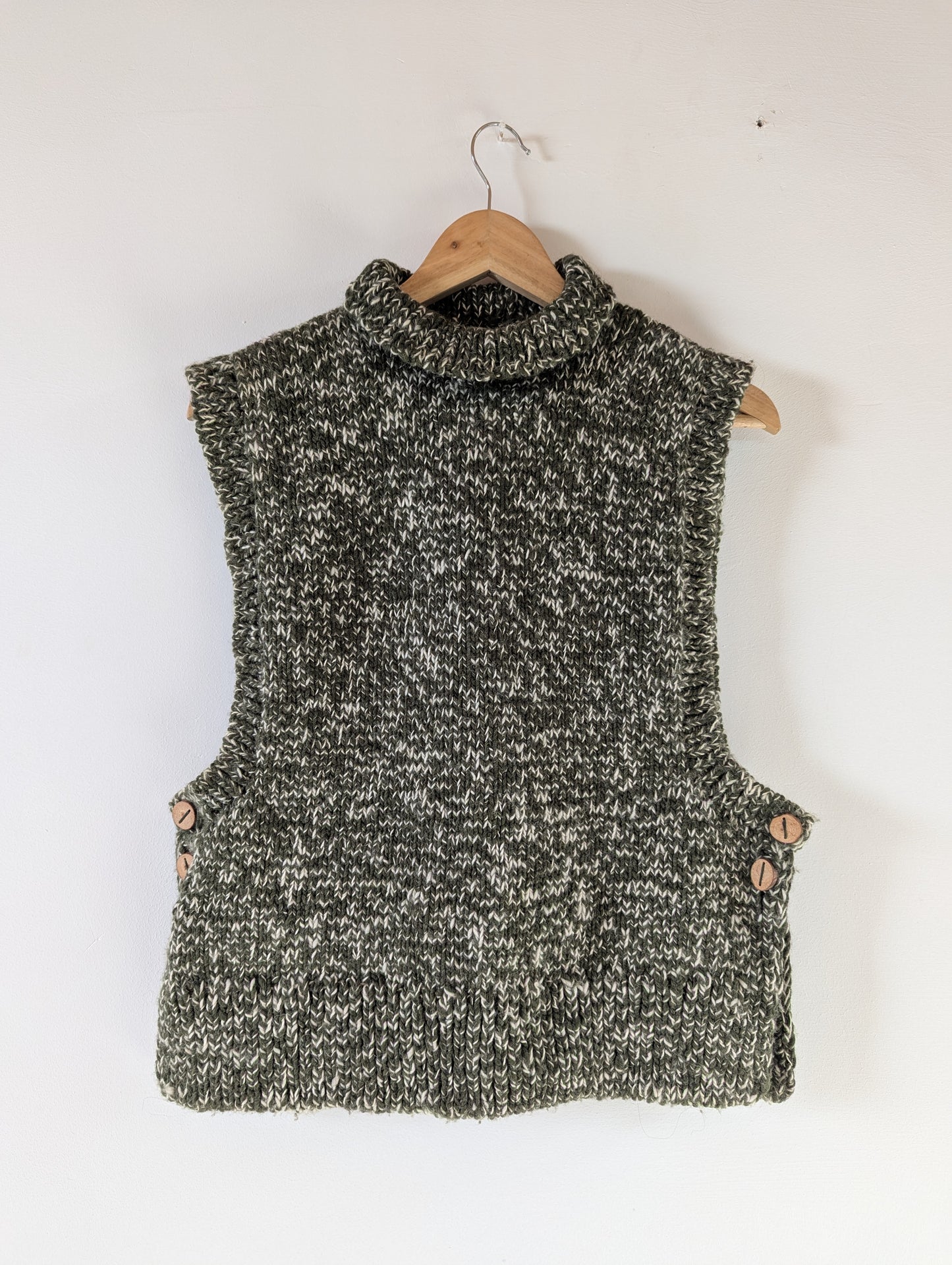 High neck handloom wool knit vest for men and women in forest green front view