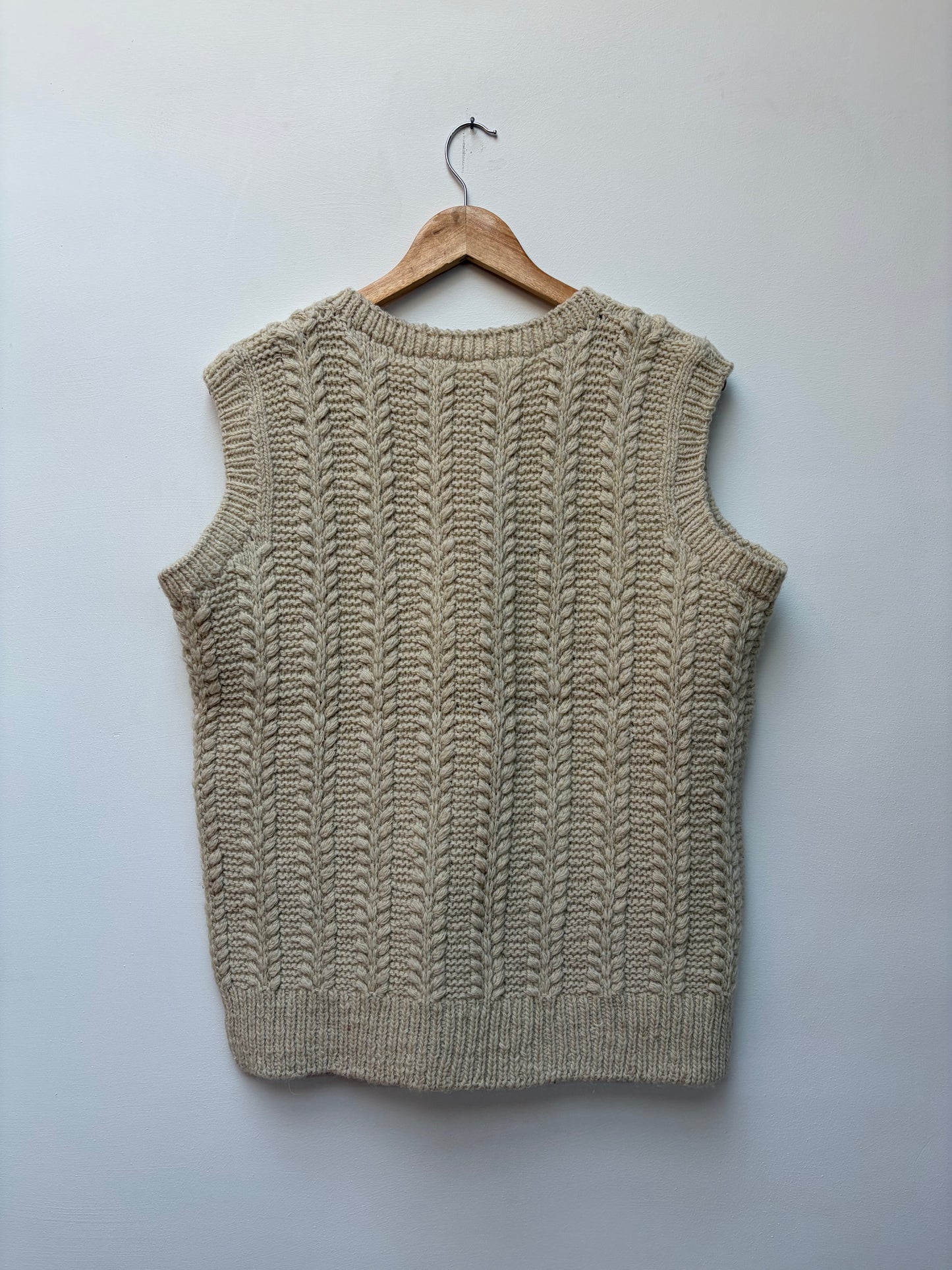 handspun cable knit wool vest in natural beige handcrafted Himalayan handloom winter vest for men and women back view 